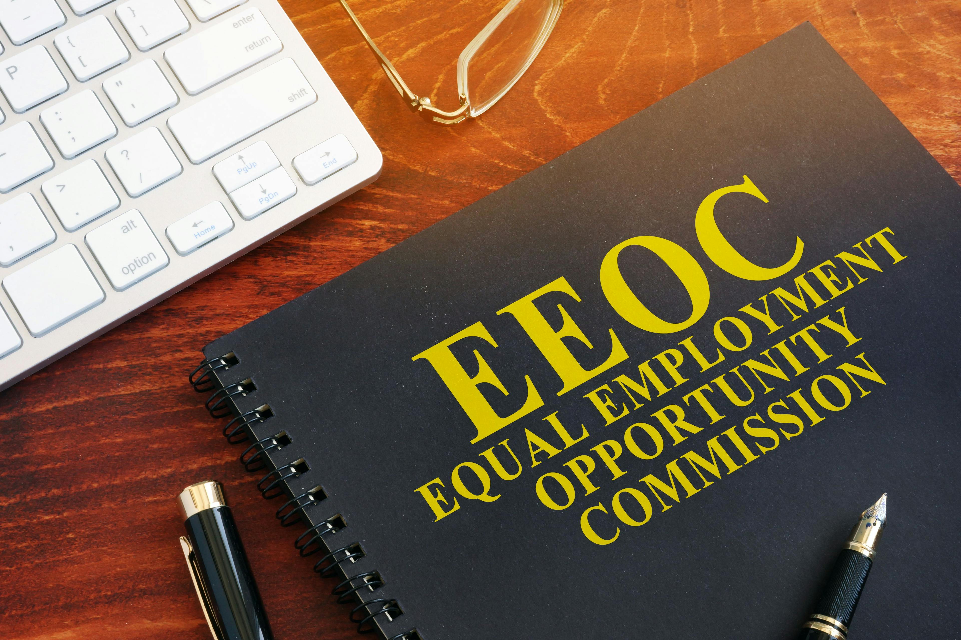 A black book with EEOC on the cover