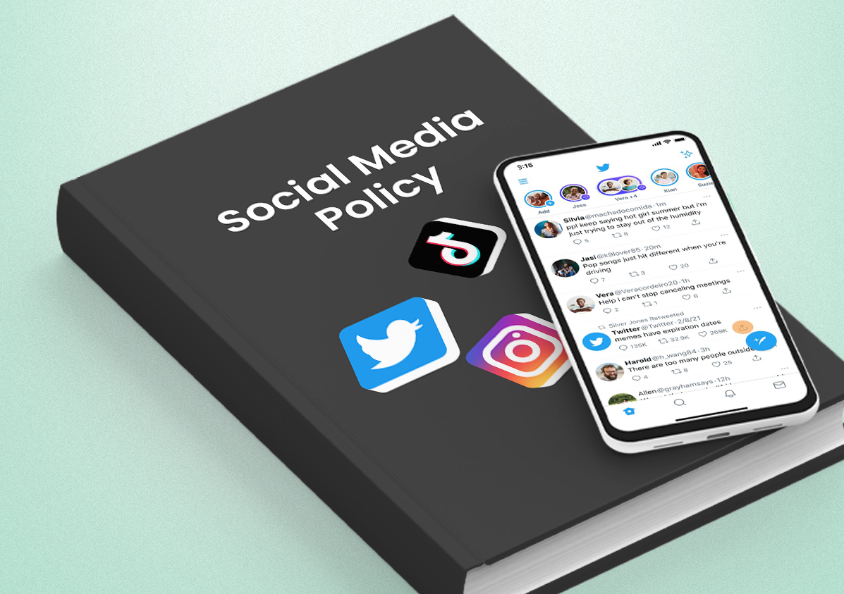 Book of social media policy with platform logos and iphone