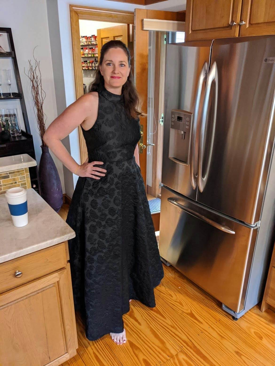 Woman works from home in a ballgown